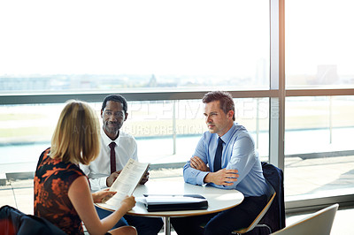 Buy stock photo Shot of a group of businesspeople having a meeting in an office