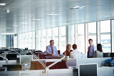 Buy stock photo Shot of a group of businesspeople talking together in an office