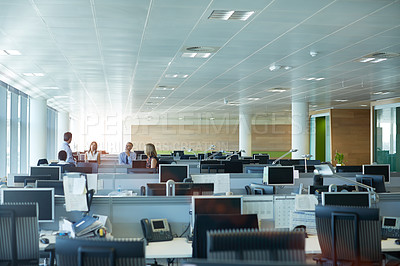 Buy stock photo Shot of a group of businesspeople talking together in an office