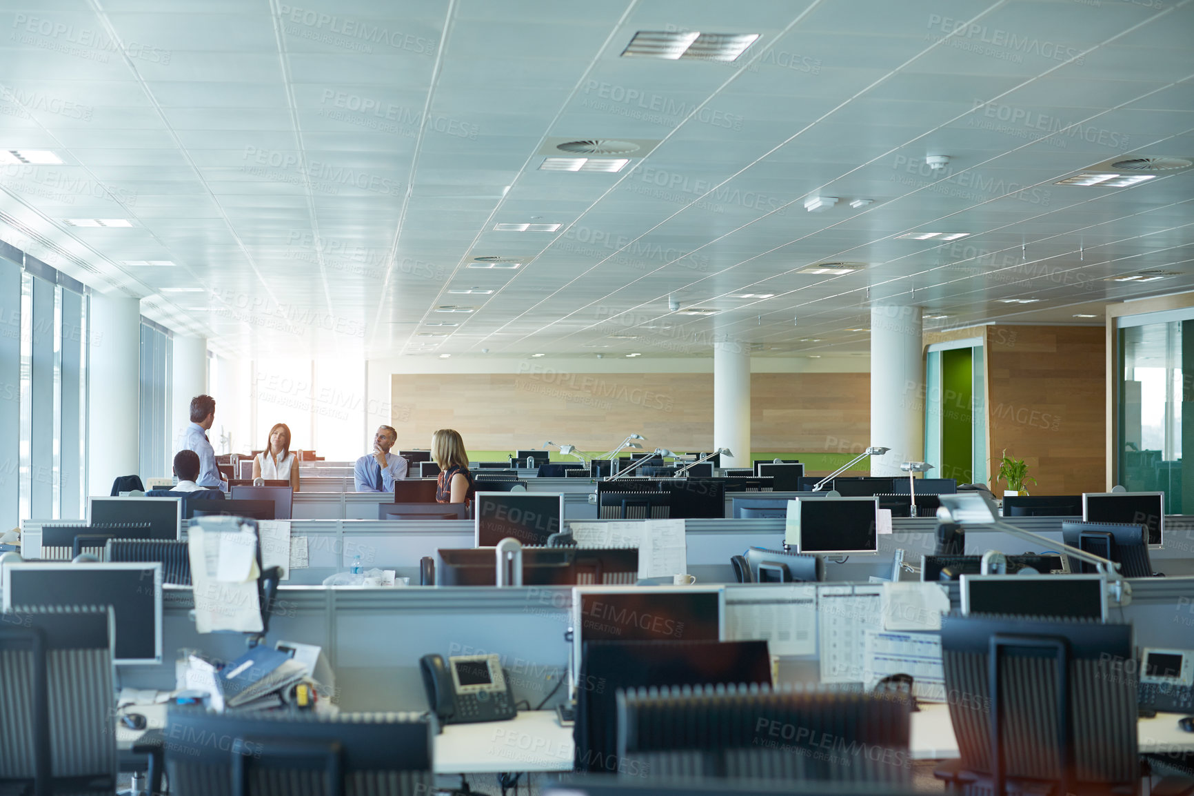 Buy stock photo Shot of a group of businesspeople talking together in an office