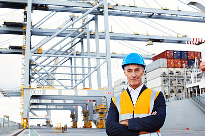 Buy stock photo Portrait of a mature man in workwear standing in a large commercial dock
