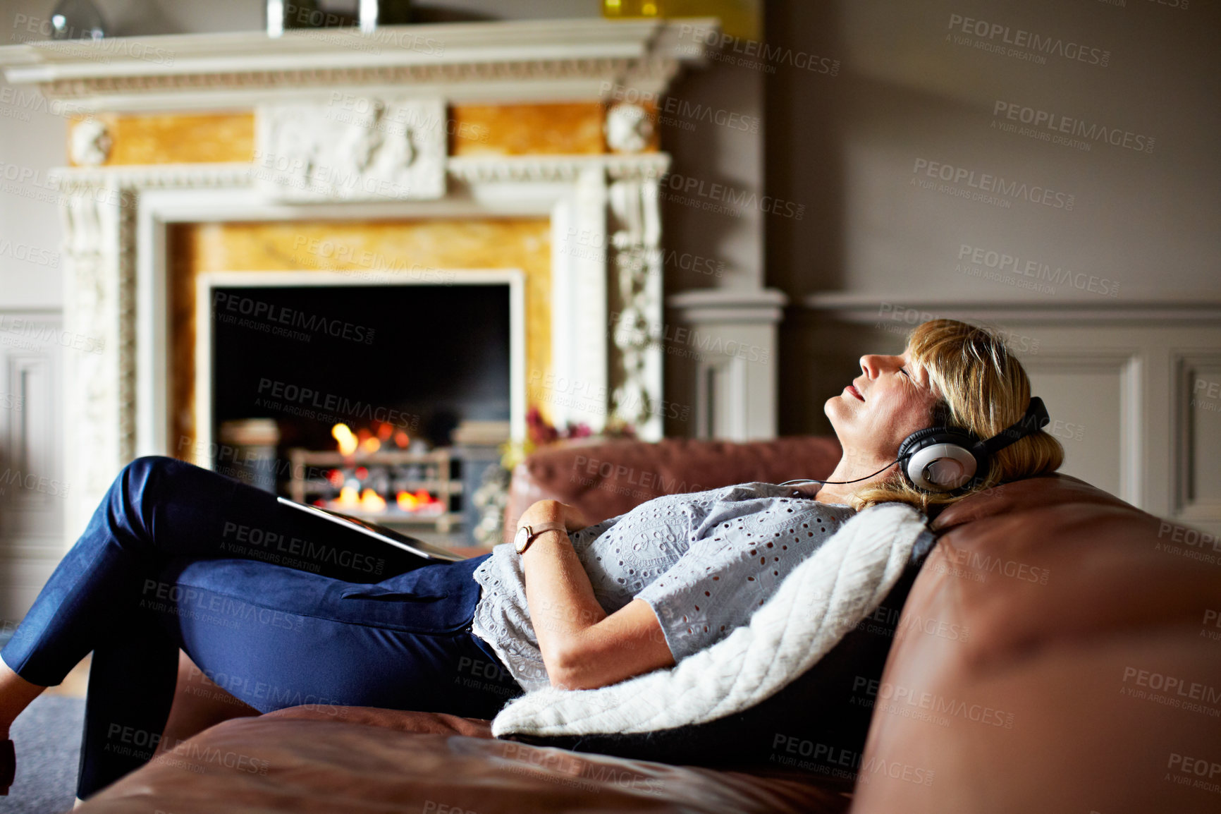 Buy stock photo Peace, relax and woman with headphones in home for streaming music, radio and subscription service. Calm, happy and mature person with audio playlist on couch, sound or listening to podcast on break