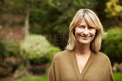 Buy stock photo Portrait of a mature woman standing outside