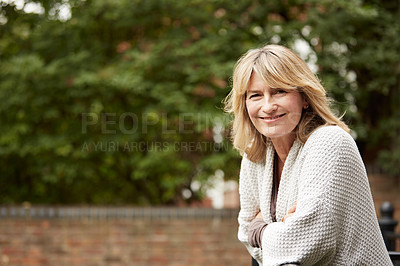 Buy stock photo Portrait of a mature woman leaning against the railing of her front porch