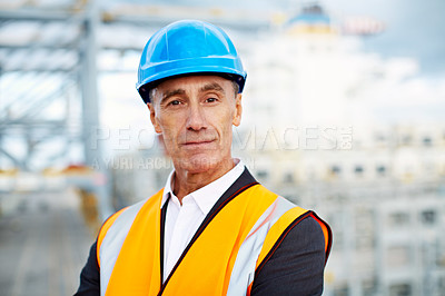 Buy stock photo Portrait of a mature man in workwear standing in a large commercial dock