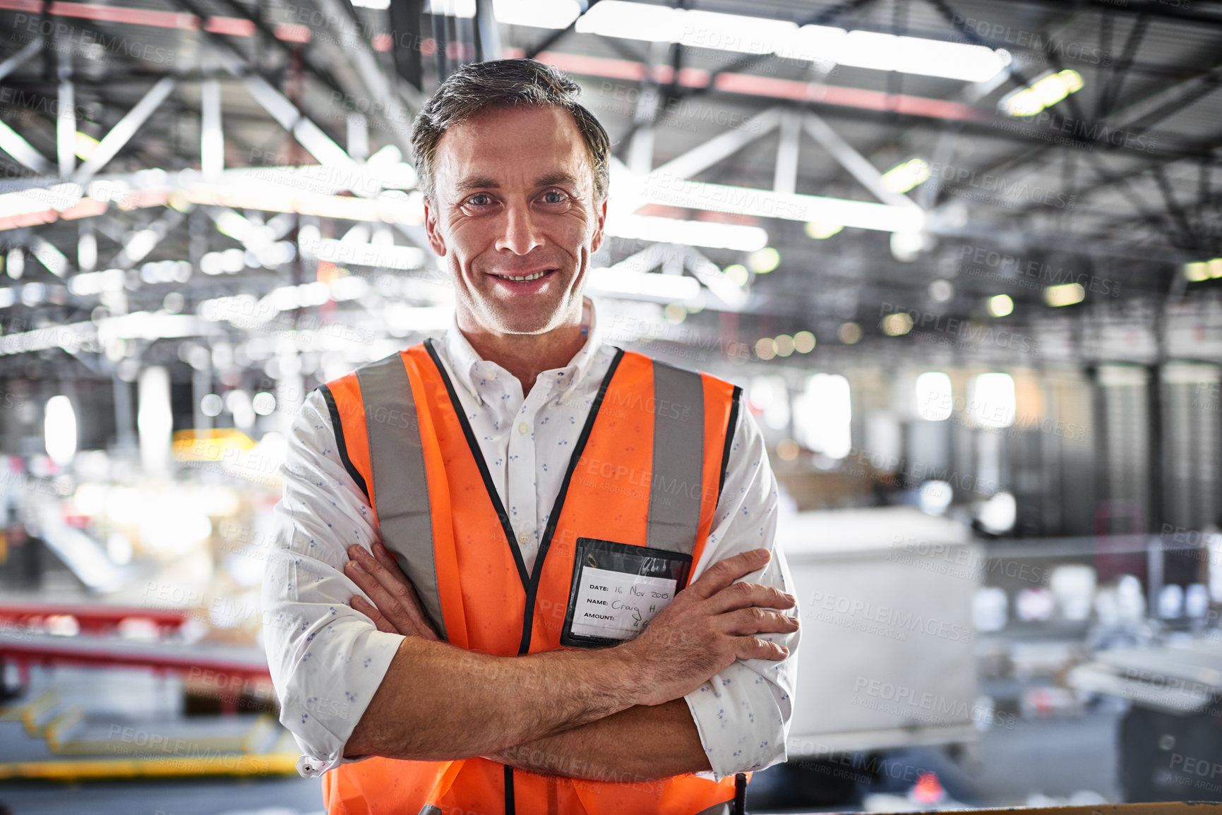 Buy stock photo Portrait of a warehouse worker standing in a large warehouse