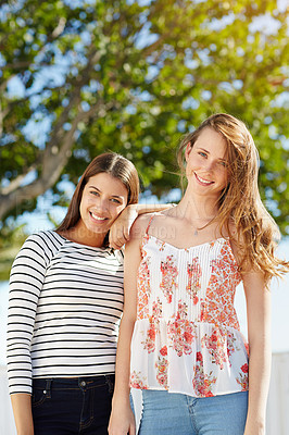 Buy stock photo Portrait of a two friends standing outside on a summer day