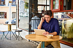 Working at a sidewalk cafe