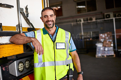 Buy stock photo Portrait of a smiling worker standing next a truck in a distribution warehouse