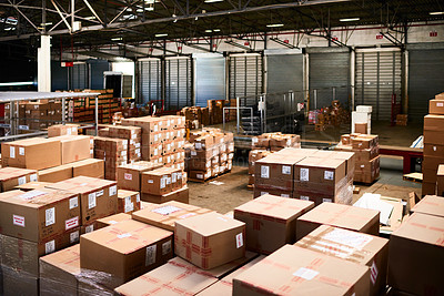 Buy stock photo Shot of a large warehouse full of boxes and containers