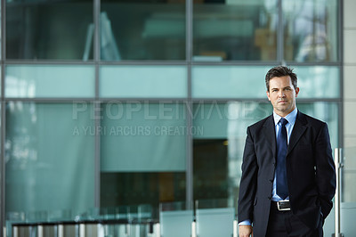 Buy stock photo Portrait of a businessman standing in the lobby of an office building