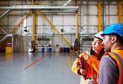 Buy stock photo Shot of two dock workers standing in a dockyard