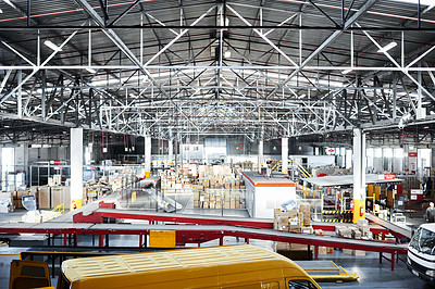 Buy stock photo Shot of a large distribution warehouse full of boxes and containers