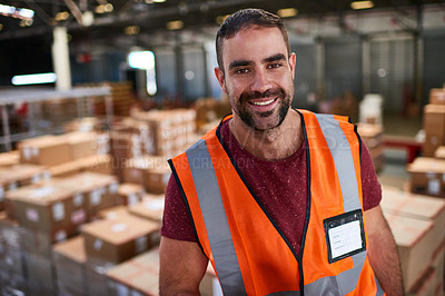 Buy stock photo Portrait of a worker standing in a large warehouse full of boxes