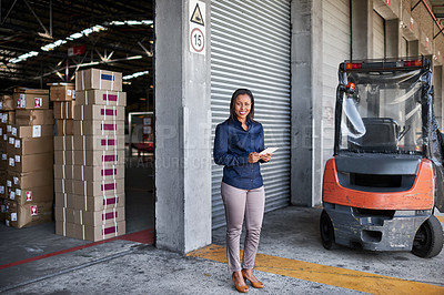 Buy stock photo Portrait of a warehouse manager holding a digital tablet while standing at the entrance to a warehouse