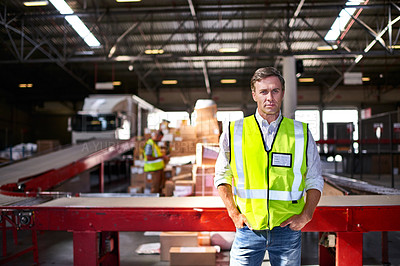 Buy stock photo Portrait of a warehouse worker standing in a large warehouse