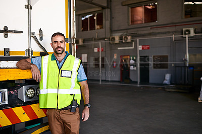 Buy stock photo Portrait of a worker standing next a truck in a distribution warehouse