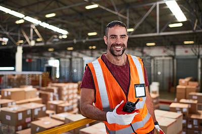 Buy stock photo Portrait of a worker standing in a large warehouse full of boxes
