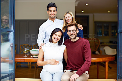 Buy stock photo Portrait of a group of young friends enjoying a get-together at home