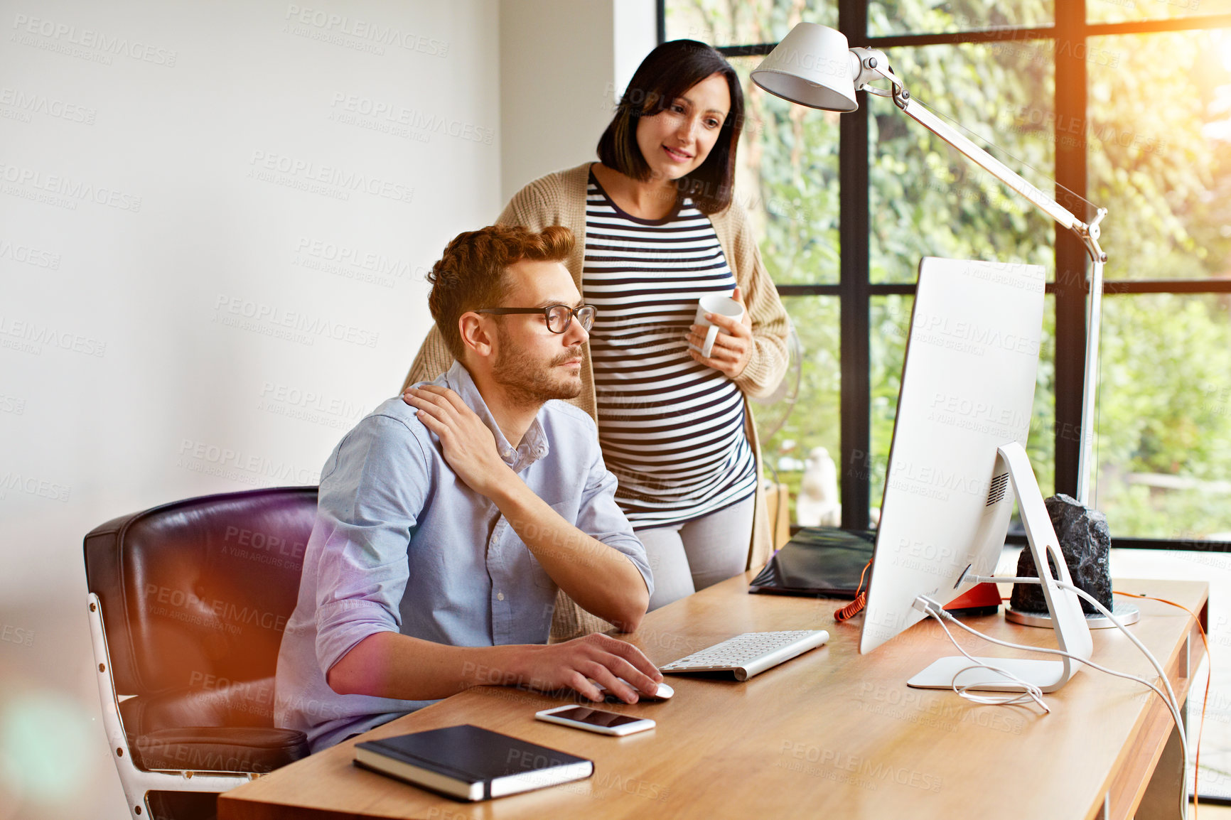 Buy stock photo Pregnancy, planning and couple in house with computer, birth checklist and review on prenatal care. Reading, space and people with tech, childbirth preparation and research for parenthood insight.