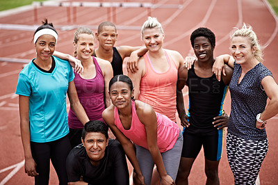 Buy stock photo Portrait of a group of friends in sports clothing standing on a running track