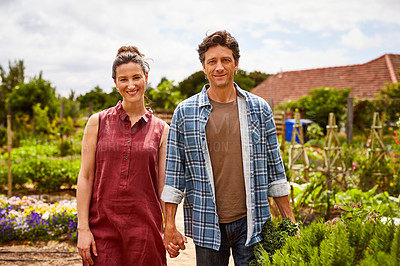 Buy stock photo Portrait of a smiling couple working in their organic garden
