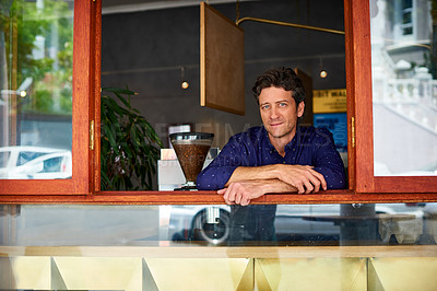 Buy stock photo Portrait of mature man looking through the window of his cafe