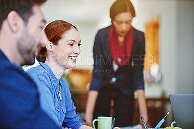 Buy stock photo Shot of a group of colleagues talking together while working in an office