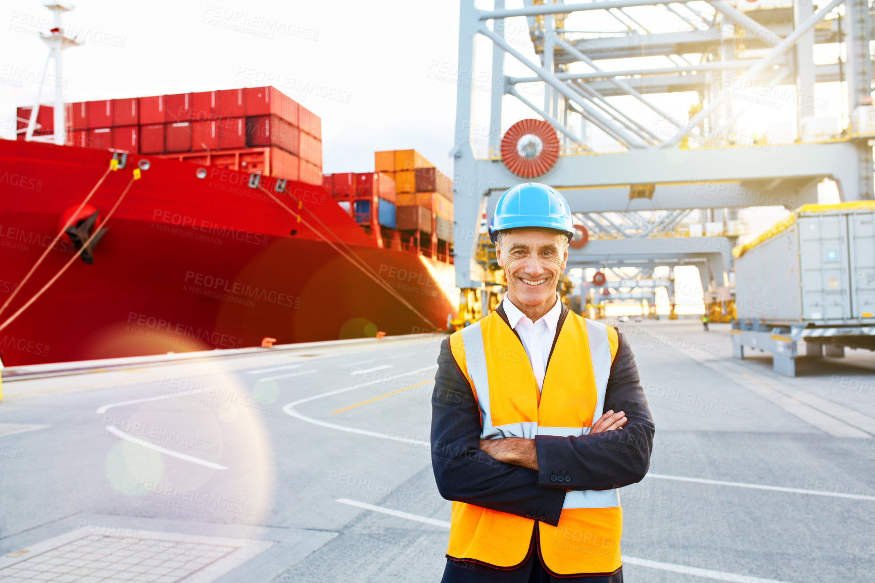 Buy stock photo Portrait of a mature man in workwear standing in a large commercial dock