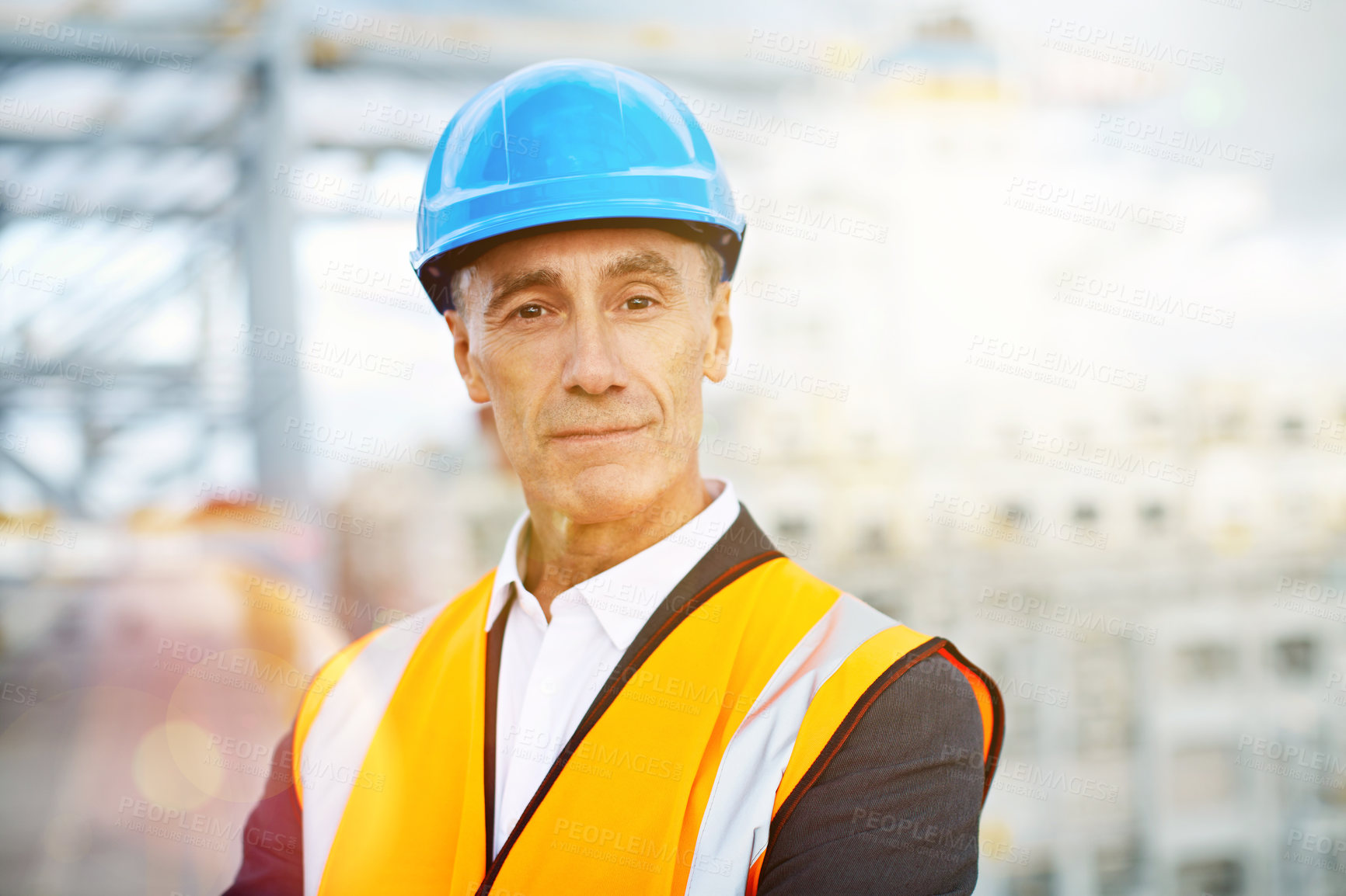 Buy stock photo Portrait of a mature man in workwear standing in a large commercial dock