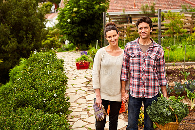 Buy stock photo Portrait of a smiling couple standing in their organic garden