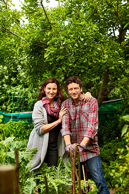 Buy stock photo Portrait of a smiling couple working in their organic garden