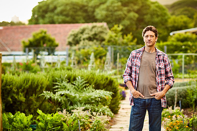 Buy stock photo Portrait of a smiling man standing in his organic garden