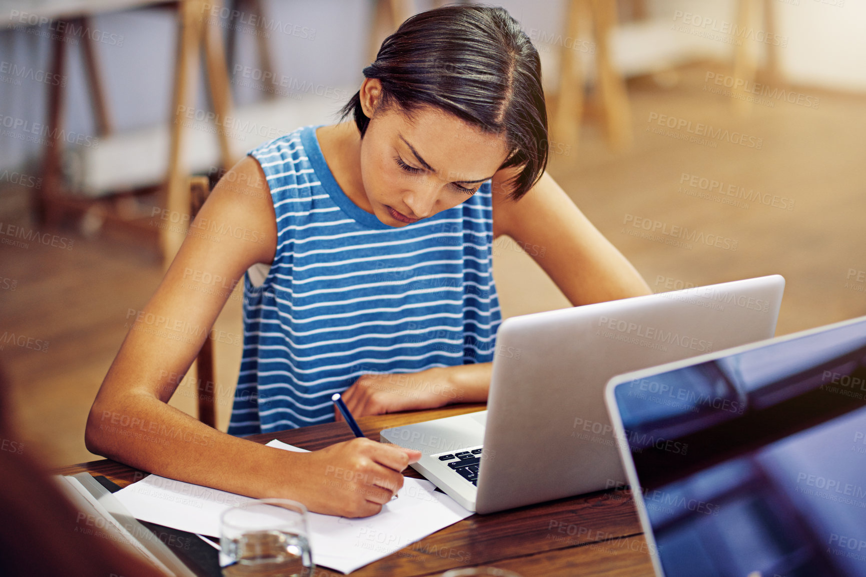 Buy stock photo Creative, woman and writing in office with laptop, research and reminder for article submission. Person, notes and document in workplace with pc, interview questions and manuscript for story feature