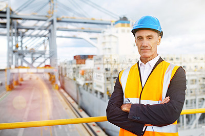 Buy stock photo Portrait of a mature man in workwear standing in a large commercial dock