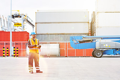 Buy stock photo Shot of a male warehouse worker working on a commercial dock