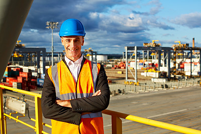 Buy stock photo Shot of a mature male warehouse worker working on a commercial dock