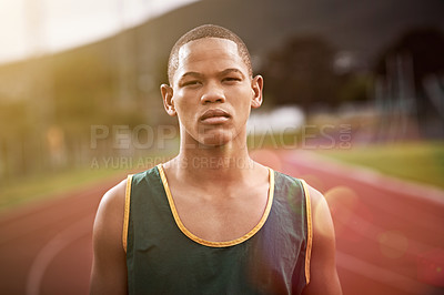 Buy stock photo Portrait of an athletic young man standing outside on the track