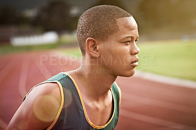 Buy stock photo Cropped shot of a young man out on the track