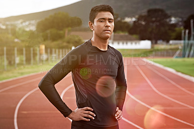 Buy stock photo Cropped shot of a young man out on the track