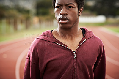 Buy stock photo Cropped shot of a young man out on the track