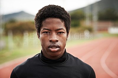 Buy stock photo Cropped shot of a young man out on the track