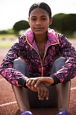 Buy stock photo Shot of a young athlete out on the track