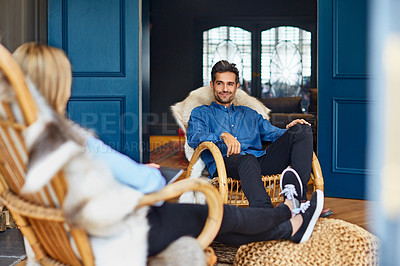 Buy stock photo Shot of a couple relaxing together on rocking chairs at home