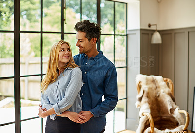 Buy stock photo Shot of an affectionate couple bonding together at home