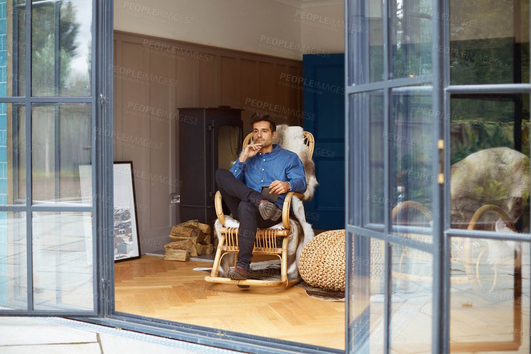 Buy stock photo Tablet, idea and man in home to relax, social media or reflection with website on internet. Rocking chair, vision or person in house with technology for online post, view or thinking on weekend break