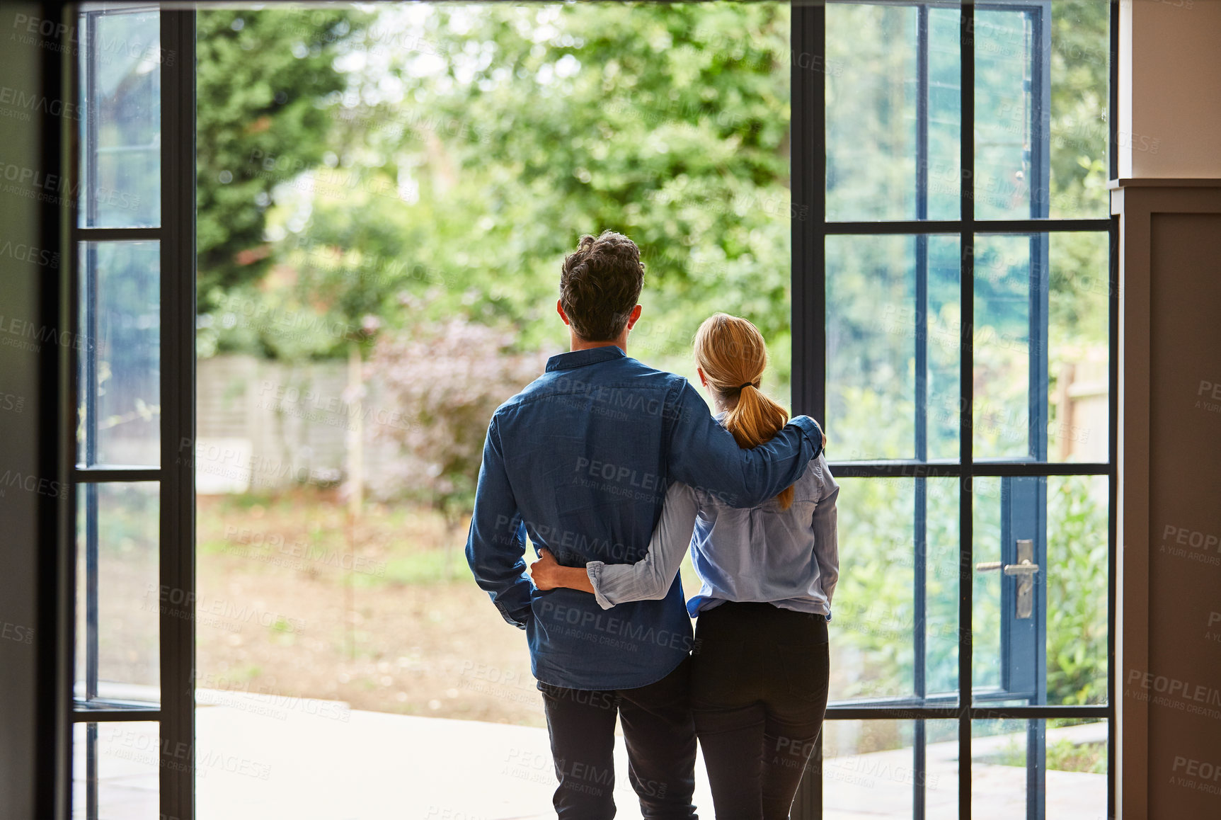 Buy stock photo Door, hug and back of couple in home on vacation, getaway or weekend break with bonding together. View, love and man embracing woman by entrance for connection, care or marriage on holiday at house.