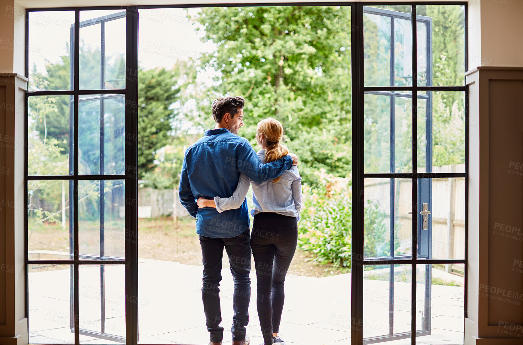 Buy stock photo Love, back and couple on patio with hug, tender connection and bonding together on weekend break. Support, smile or people in home with embrace, partner trust or happy moment in romantic relationship