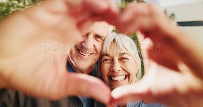 Buy stock photo Senior, face and happy couple with heart hands in nature for love, commitment or relationship. Portrait, elderly man and woman with smile, like emoji or care for romantic gesture, support or health