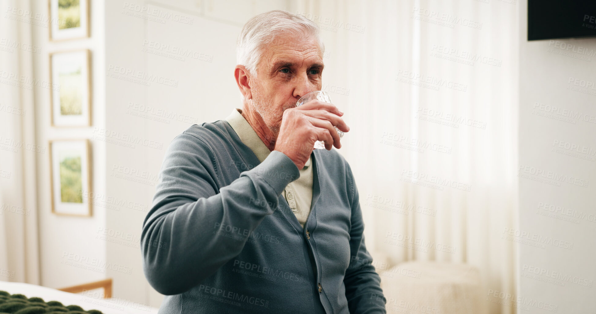 Buy stock photo Drinking water, health and senior man in home for wellness, nutrition or diet benefits in bedroom. Retirement, thirsty person and glass with liquid for hydration, electrolytes and minerals at house